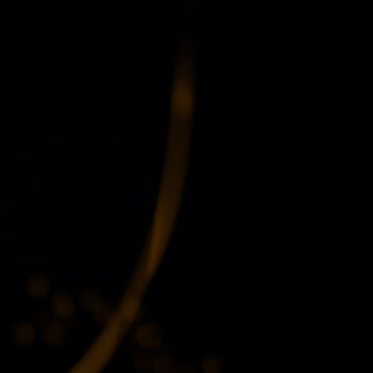 Abstract gold light arc on dark background